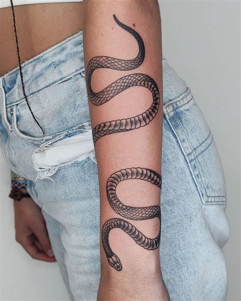 gucci snake arm tattoo|snake tattoo around arm.